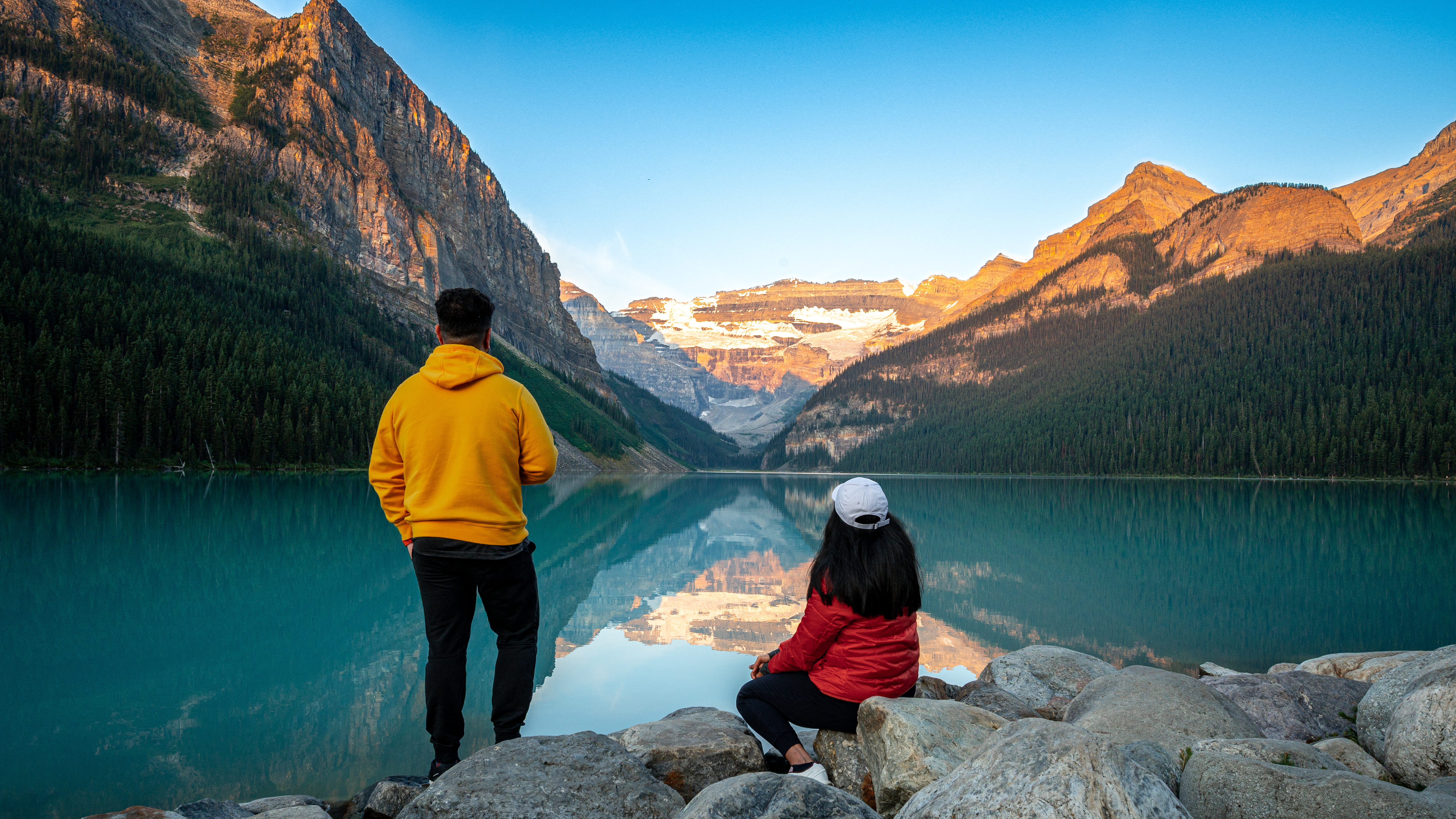 Watching the alpenglow build over Lake Louise at sunrise